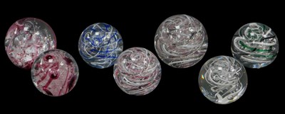 Lot 176 - Seven Langham glass paperweights, each of...