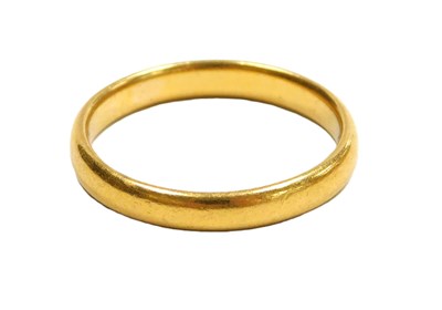 Lot 214 - A 22ct gold wedding band, size M 1/2, 3.6g.