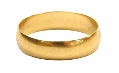 Lot 216 - A 22ct gold wedding band, size O, 2.8g.