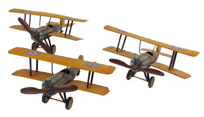 Lot 265 - Three tinplate biplanes, in yellow, blue and...
