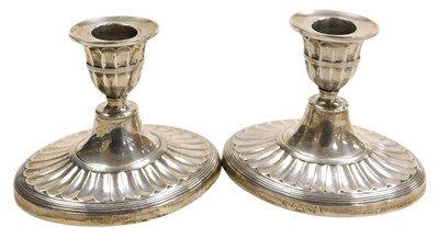 Lot 305 - A pair of Edward VII silver candlesticks, of...