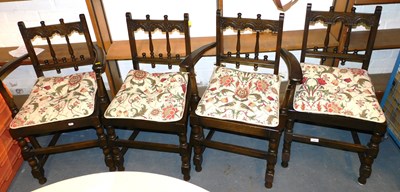 Lot 1077 - A set of four Ercol Gothic style dining chairs,...