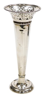 Lot 306 - A George V silver loaded vase, of trumpet form,...