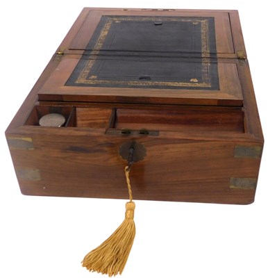 Lot 269 - A Victorian walnut and brass bound writing...