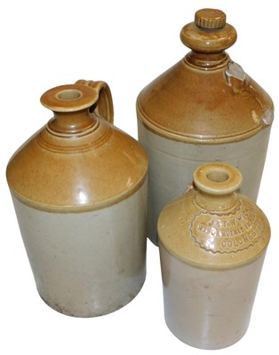 Lot 407 - Three stoneware flagons, one bearing plaque...