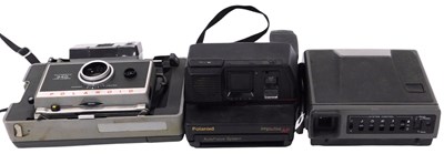 Lot 428 - A Polaroid 340 automatic land camera, and two...