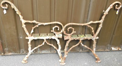 Lot 448 - A pair of Victorian cast iron bench ends, each...