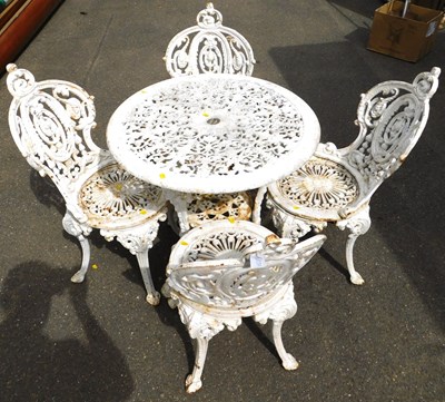 Lot 449 - A cast iron garden table, with pierced top and...