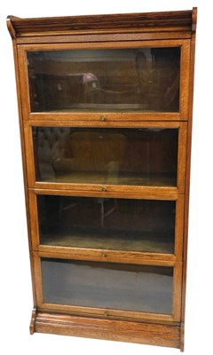 Lot 465 - A Globe Wernicke style oak bookcase, with four...