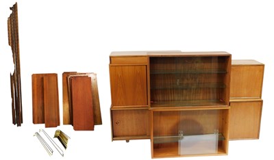 Lot 471 - A mid-century modular teak wall unit, possibly...