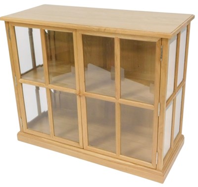 Lot 792 - A modern light elm effect display two door...