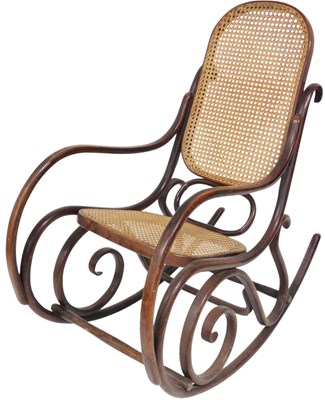 Lot 509 - A bentwood rocking chair, with caned seat and...