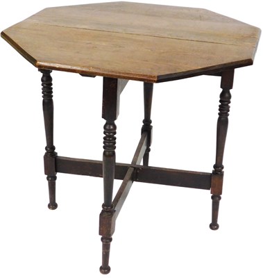 Lot 515 - An Edwardian elm coaching table, with canted...