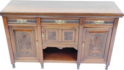 Lot 524 - A late Victorian carved walnut...