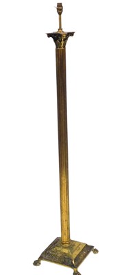 Lot 527 - A brass Corinthian standard lamp. Buyer Note:...