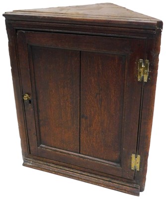 Lot 529 - A George II oak hanging corner cupboard, 71cm...