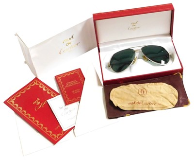Lot 583 - A pair of Must de Cartier Paris aviator...