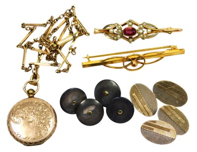 Lot 596 - A 9ct gold bar brooch, set with garnet and...