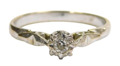 Lot 601 - An illusion set diamond solitaire ring, in...