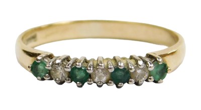 Lot 602 - A 9ct gold half hoop ring set with cz and...