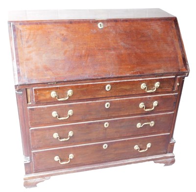 Lot 645 - A George III mahogany bureau, the fall opening...