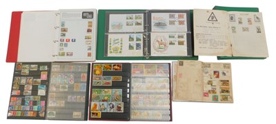 Lot 232 - An album containing first day covers, another...