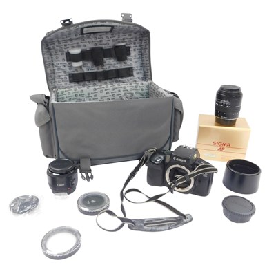 Lot 256 - A Canon EOS 750 camera, together with a Canon...