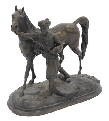 Lot 258 - A bronze figure group, modelled as a gentleman...