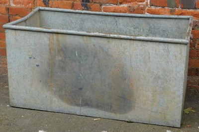 Lot 297 - A galvanised metal water trough, of...