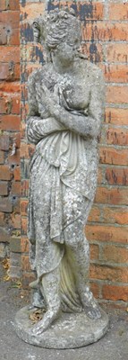 Lot 300 - A composition stone garden figure, modelled as...