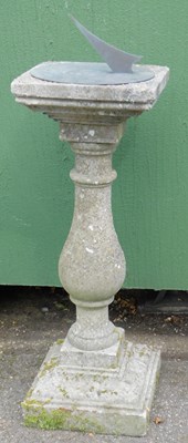 Lot 303 - A composition stone sundial, the top with a...
