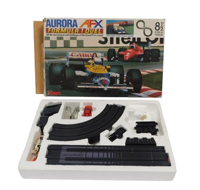 Lot 367 - An Aurora AFX Formula 1 Dual slot car set by...