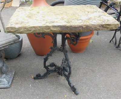 Lot 307 - A garden table, with a rectangular stone top,...