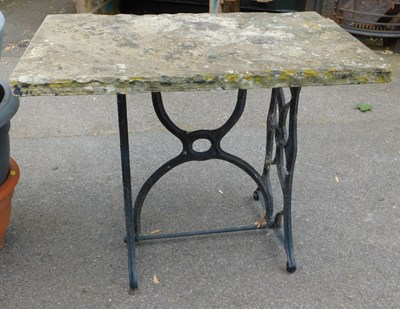 Lot 309 - A garden table, with a rectangular stone top,...