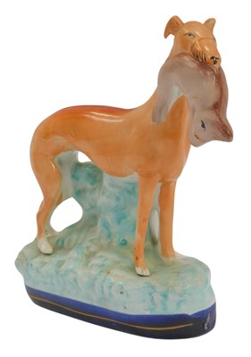 Lot 271 - A Staffordshire style figure, modelled as a...