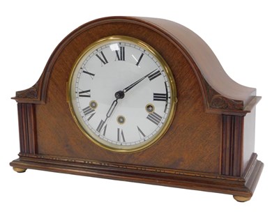 Lot 283 - An Edwardian mahogany mantel clock, the...
