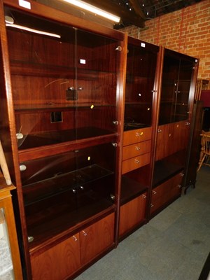 Lot 1049 - Three lounge units, with smoked glass doors....
