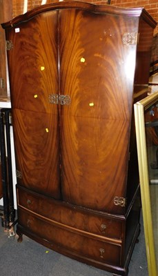 Lot 1053 - A bachelor's wardrobe, two doors over two...