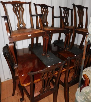 Lot 1076 - A mahogany extending dining table, and eight...