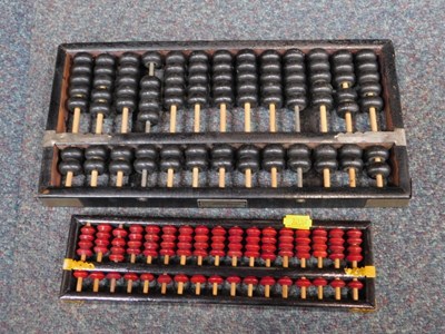 Lot 2018 - A Lotus Brand abacus and another abacus. (2)