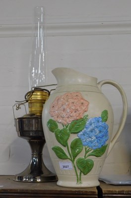 Lot 2027 - A large floral covered vase, and an oil lamp.