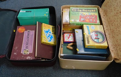 Lot 2050 - Two suitcases containing games.