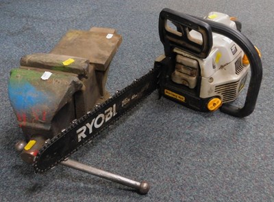 Lot 2051 - A large tabletop bench vice and a Ryobi petrol...