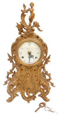 Lot 354 - A Louis XV style brass mantel clock, the...