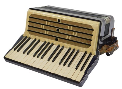Lot 429 - A Hohner Carmen II accordion, twenty-four...