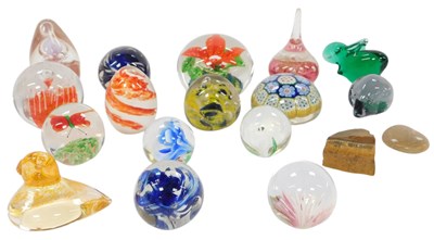 Lot 442 - A group of glass paperweights, to include a...