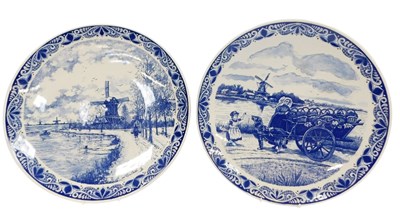 Lot 260 - A pair of 20thC Delft chargers, one depicting...