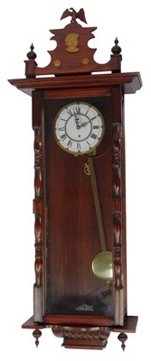 Lot 466 - An oak cased Vienna wall clock, the white...
