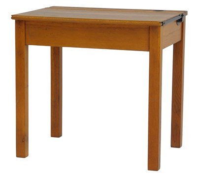 Lot 485 - An oak child's school desk, the top with a...
