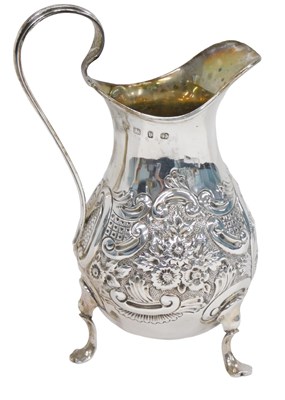 Lot 80 - A Victorian silver cream jug, with embossed...